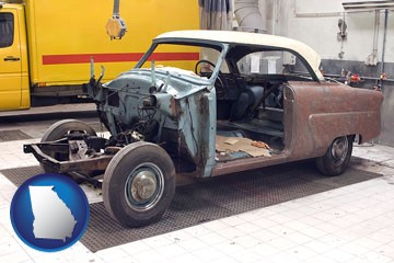 a vintage automobile in an auto body shop - with Georgia icon