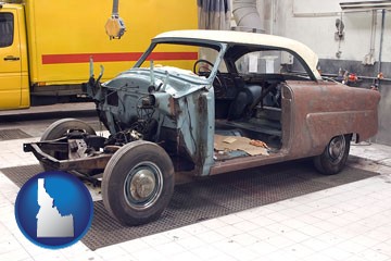 a vintage automobile in an auto body shop - with Idaho icon