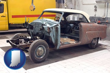 a vintage automobile in an auto body shop - with Indiana icon