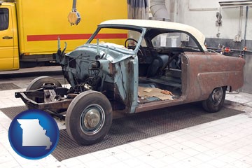 a vintage automobile in an auto body shop - with Missouri icon