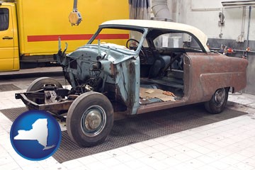 a vintage automobile in an auto body shop - with New York icon