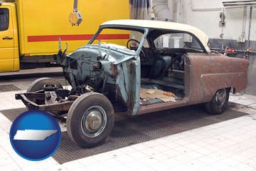 a vintage automobile in an auto body shop - with Tennessee icon