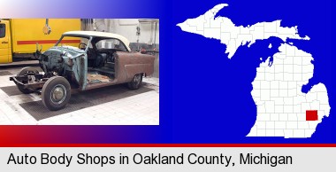 a vintage automobile in an auto body shop; Oakland County highlighted in red on a map
