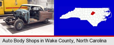 a vintage automobile in an auto body shop; Wake County highlighted in red on a map