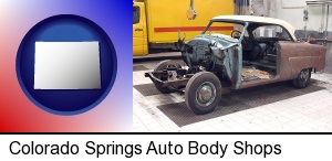 a vintage automobile in an auto body shop in Colorado Springs, CO