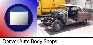 Denver, Colorado - a vintage automobile in an auto body shop