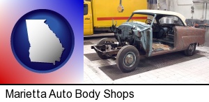a vintage automobile in an auto body shop in Marietta, GA