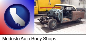 Modesto, California - a vintage automobile in an auto body shop