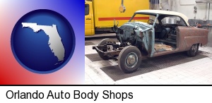 a vintage automobile in an auto body shop in Orlando, FL