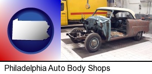 Philadelphia, Pennsylvania - a vintage automobile in an auto body shop