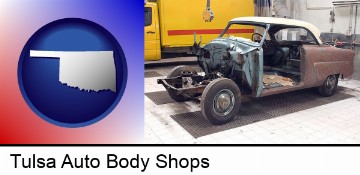 a vintage automobile in an auto body shop in Tulsa, OK