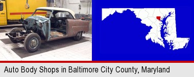 a vintage automobile in an auto body shop; Baltimore City highlighted in red on a map