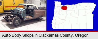 a vintage automobile in an auto body shop; Clackamas County highlighted in red on a map