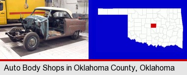 a vintage automobile in an auto body shop; Oklahoma County highlighted in red on a map