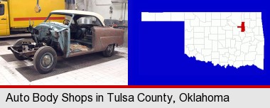 a vintage automobile in an auto body shop; Tulsa County highlighted in red on a map