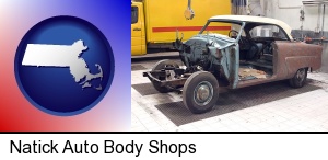 a vintage automobile in an auto body shop in Natick, MA